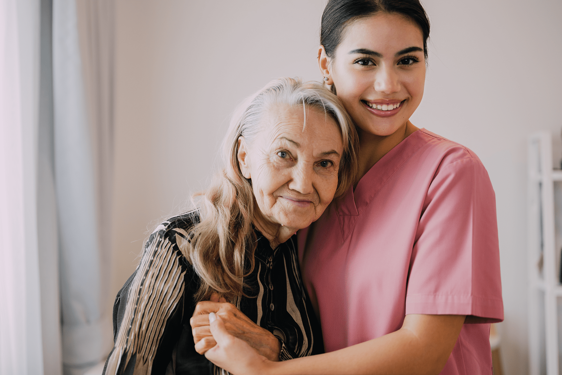 elderly woman with caregiver