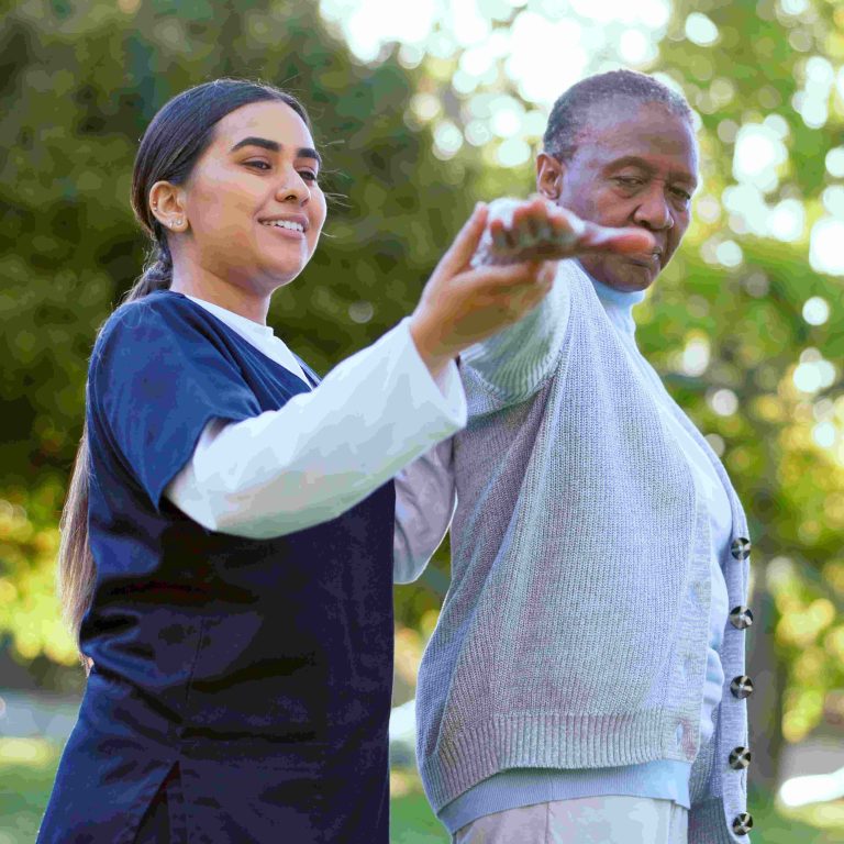 Elderly, woman and caregiver with arm stretching for exercise, workout or fitness in a park with sm.