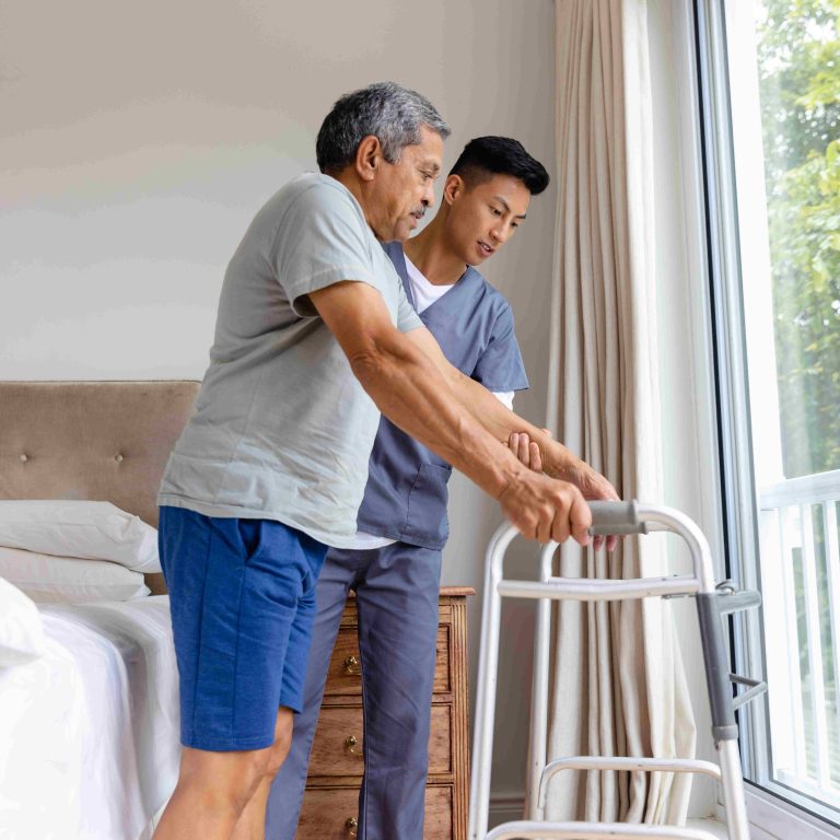 Diverse male doctor advising and senior male patient using crutches at home. Medical services, check up, home visit, healthcare, wellbeing and senior lifestyle, unaltered. Diverse male doctor advising and senior male patient using crutches at home. Medical services, check up, home visit, healthcare, wellbeing and senior lifestyle, unaltered.