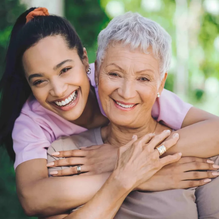She wears her journey on her face. Portrait of a young nurse caring for an older woman